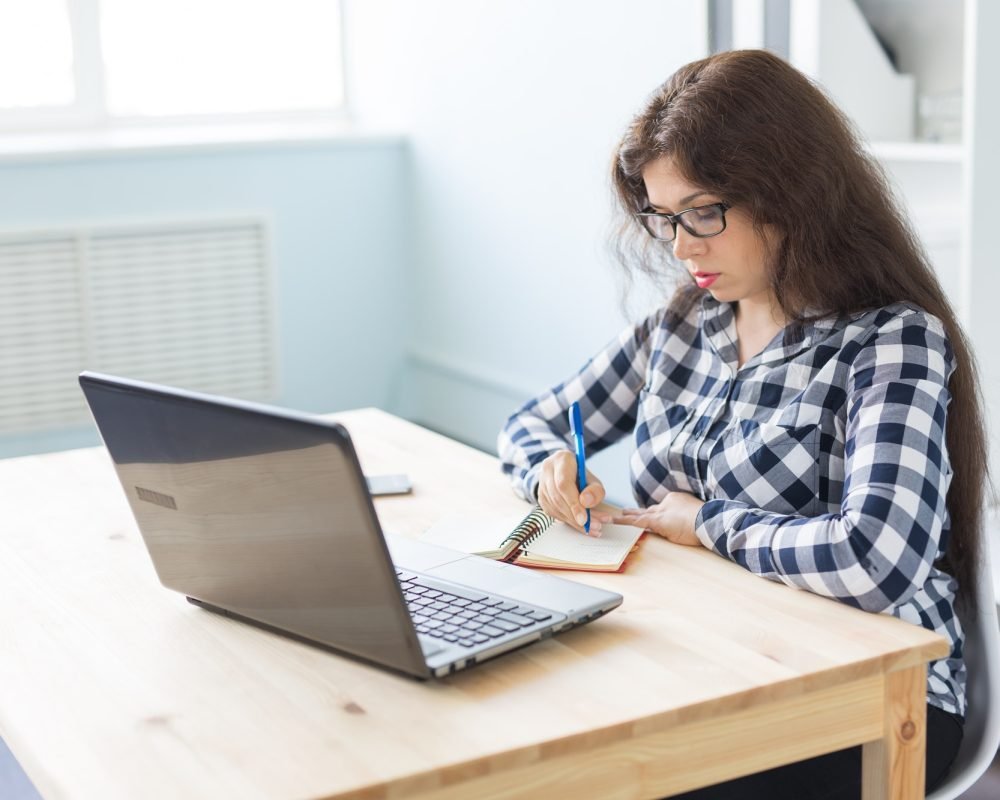 office-and-business-people-concept-woman-is-working-at-the-office-with-laptop.jpg